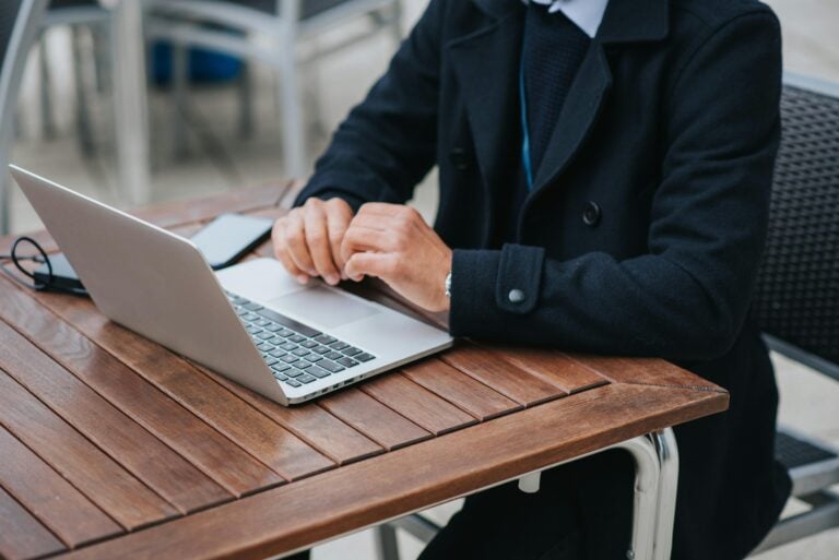 man on laptop learning how to decline a job offer